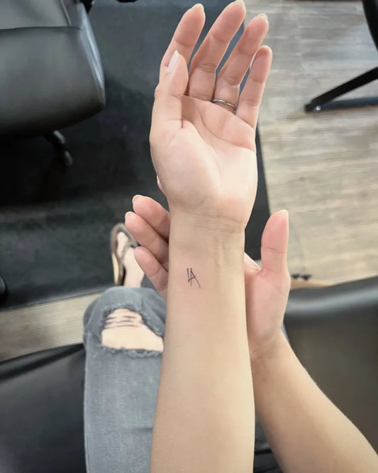 Small Minimalist Letter A on Women Wrist Tattoo by @east_01