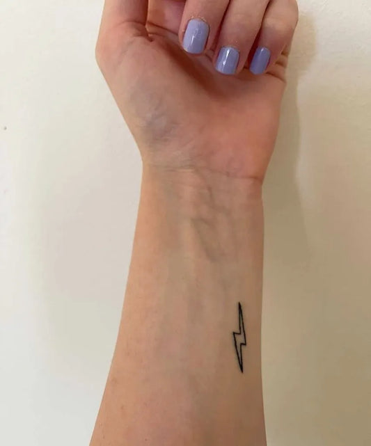 Small Minimalist Lightning Tattoo on Women Wrist by @kosmarta_tattoo