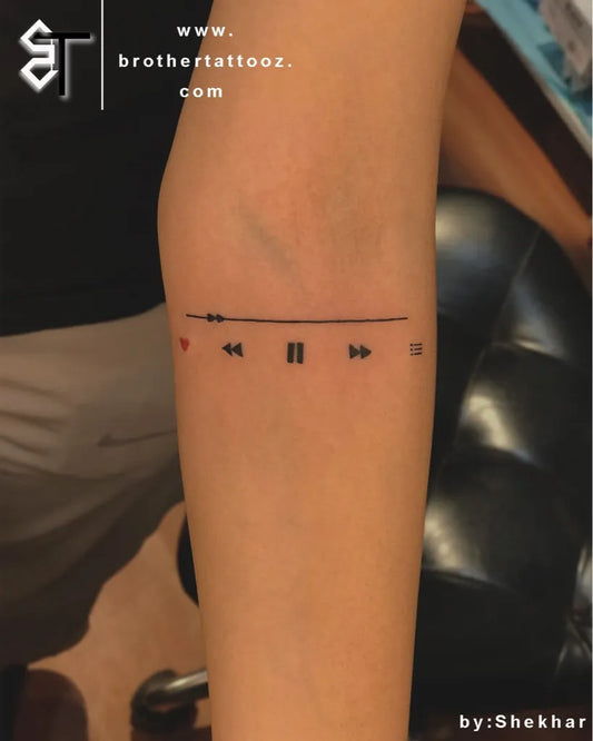 Small Minimalist Line Art Music Tattoo on Women Forearm by @brothertattooz