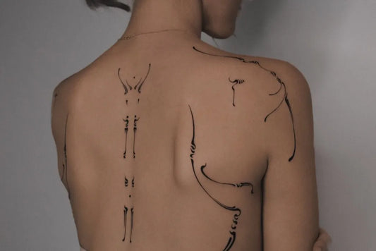 Small Minimalist Line Art Woman on Back Tattoo by @lido_midori