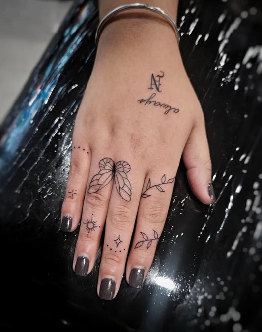 Small Minimalist Linework Butterfly Wings Symbols on Women Hand Tattoo by @tattboy1000