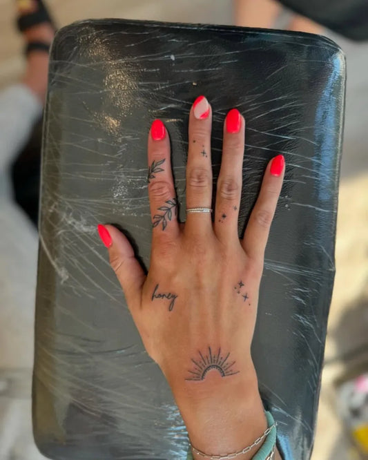 Small Minimalist Linework Sun and Leaf on Women Hand Tattoo by @nude_skinbar