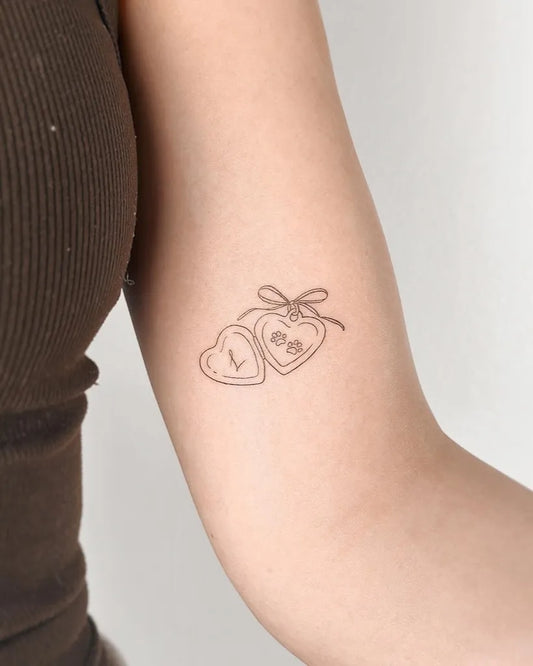 Small Minimalist Linked Hearts with LB on Women Arm Tattoo by @cha.tattoo