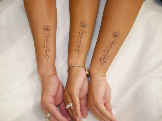 Small Minimalist Lotus and Script on Friends Forearms Matching Tattoo by @victattoo22