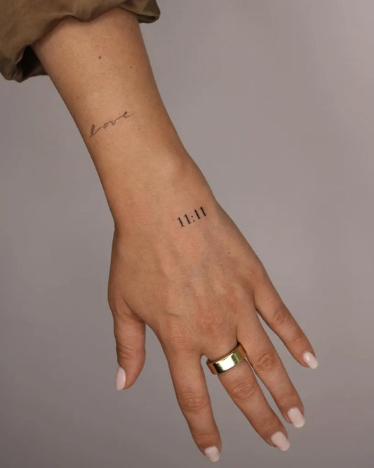 Small Minimalist Love 1111 on Women Wrist Tattoo by @julesdrytattoo