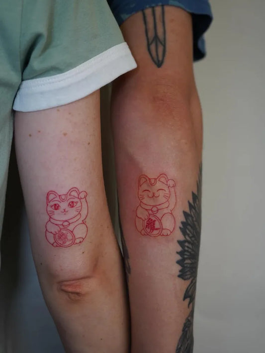 Small Minimalist Maneki neko on Couple on Arms Matching Tattoo by @fo.draws