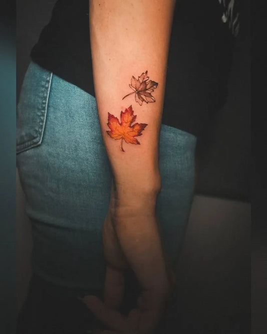 Small Minimalist Maple Leaves on Women Forearm Tattoo by @ameliefleur_