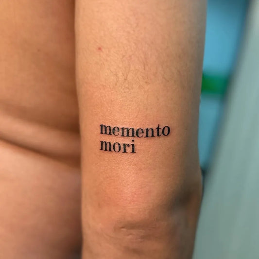 Small Minimalist Memento Mori on Men Arm Tattoo by @cosmos.tattoostudio