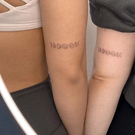 Small Minimalist Moon Phases Tattoo on Women Arm by @alina.tattoo.ink