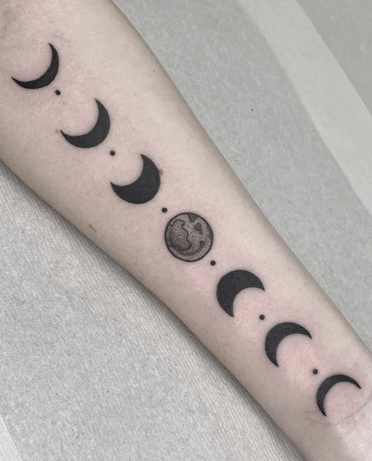 Small Minimalist Moon Phases Tattoo on Women Arm by @marissakaytattoo