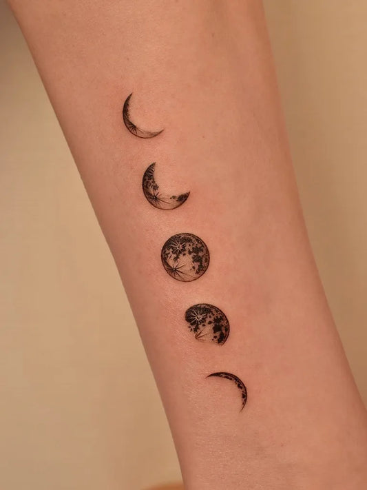 Small Minimalist Moon Phases Tattoo on Women Arm by @tattooer_jina