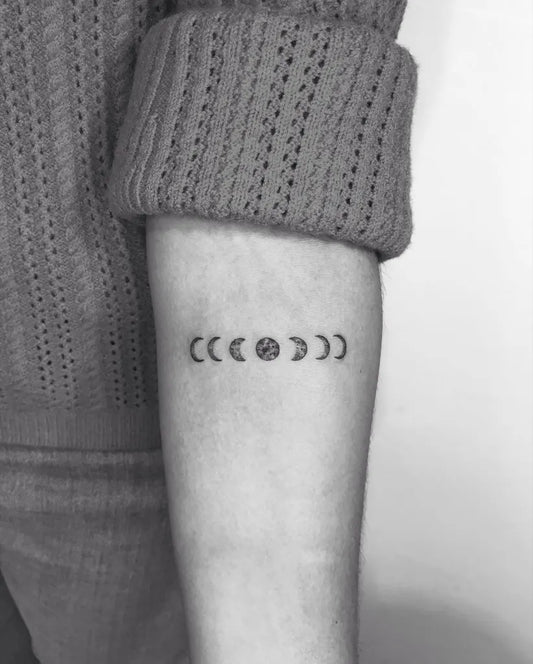 Small Minimalist Moon Phases Tattoo on Women Forearm by @linaresflavio_tattoo