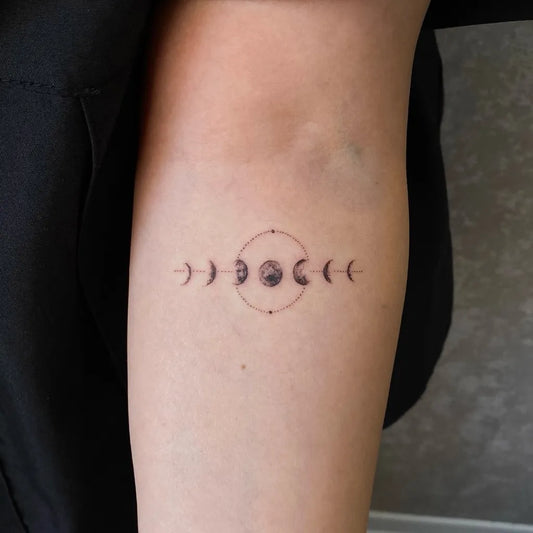 Small Minimalist Moon Phases Tattoo on Women Forearm by @shdkrtattoo