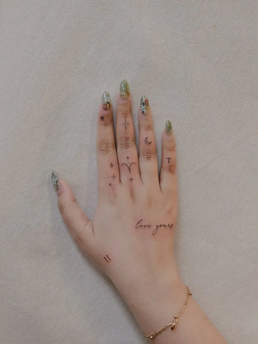 Small Minimalist Moon Stars Love on Women Fingers Tattoo by @tavi_tattoo