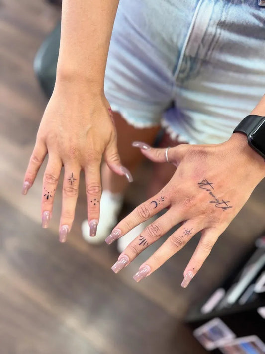 Small Minimalist Moon and Script on Women Hands Tattoo by @emburdentattoo