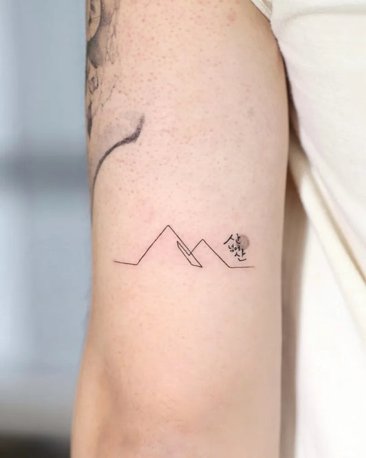 Small Minimalist Mountain Sun Tattoo on Men Arm by @hanzulink