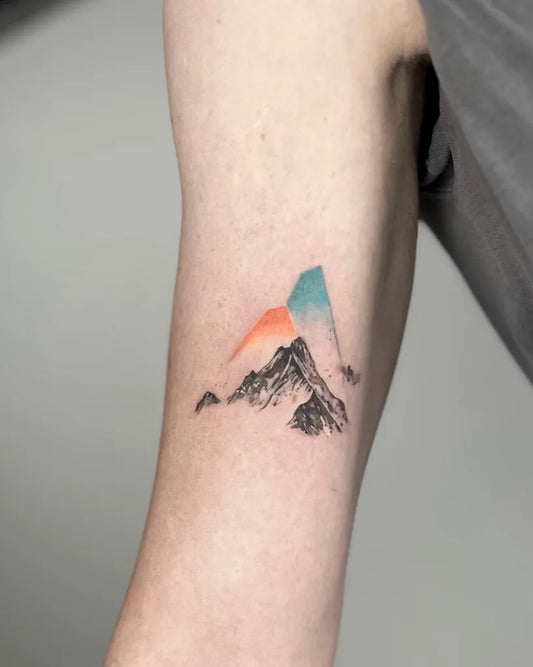 Small Minimalist Mountain Tattoo on Men Arm by @monikamoni.art