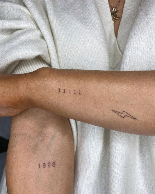 Small Minimalist Numbers Lightning Bolt Tattoo on Women Forearm by @inkster