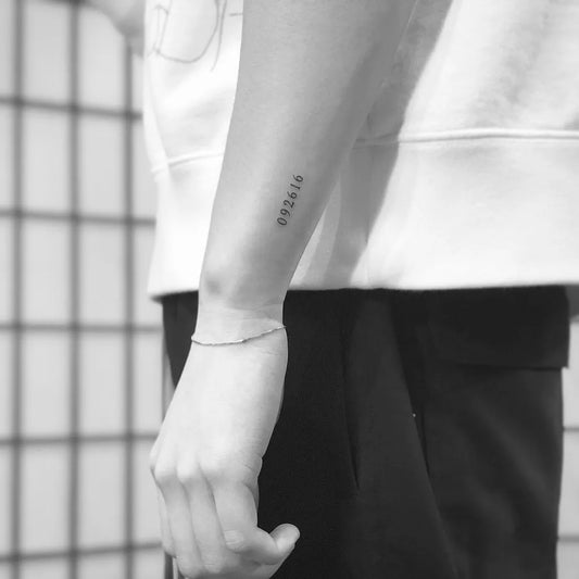 Small Minimalist Numbers Tattoo on Men Forearm by @tattoovasquez