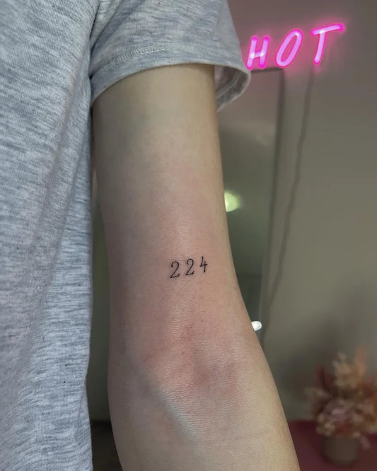 Small Minimalist Numbers Tattoo on Women Forearm by @pinkcosmetictattoo