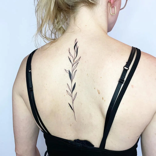 Small Minimalist Olive Branch on Women Spine Tattoo by @stienevsart