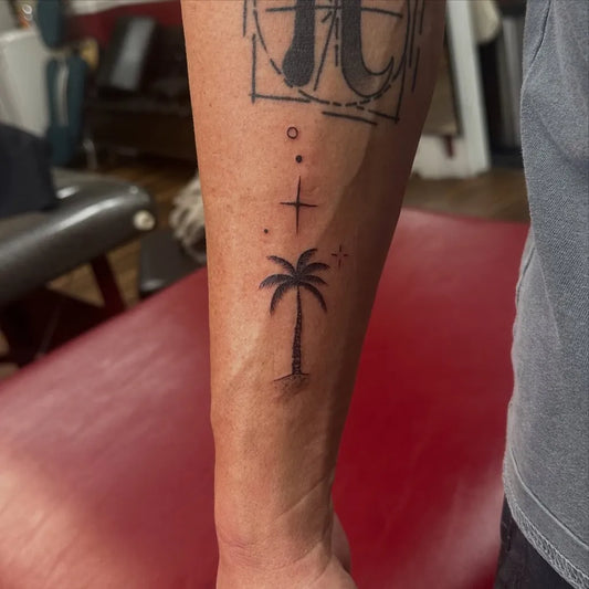 Small Minimalist Palm Tree Cross Dots Tattoo on Men Arm by @boscolaynetattoo
