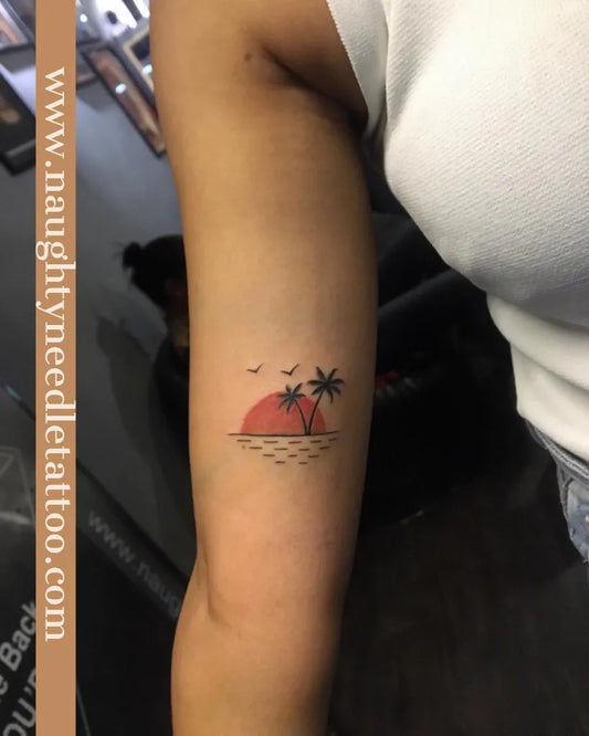 Small Minimalist Palm Tree Sunset Birds Tattoo on Women Arm by @naughtyneedlestattoos