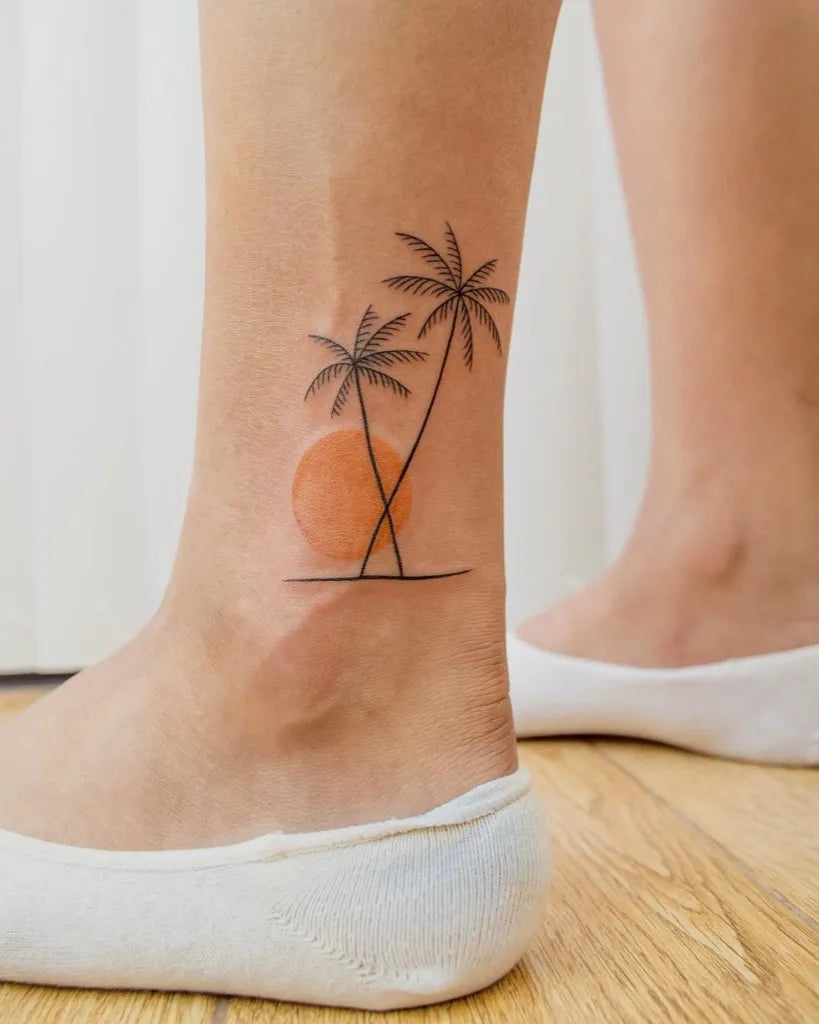 Small Minimalist Palm Tree Sunset Tattoo on Women Ankle by @rydelreib_ta