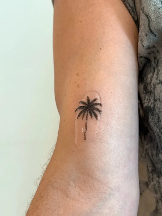 Small Minimalist Palm Tree Tattoo on Men Arm by @lexibkip