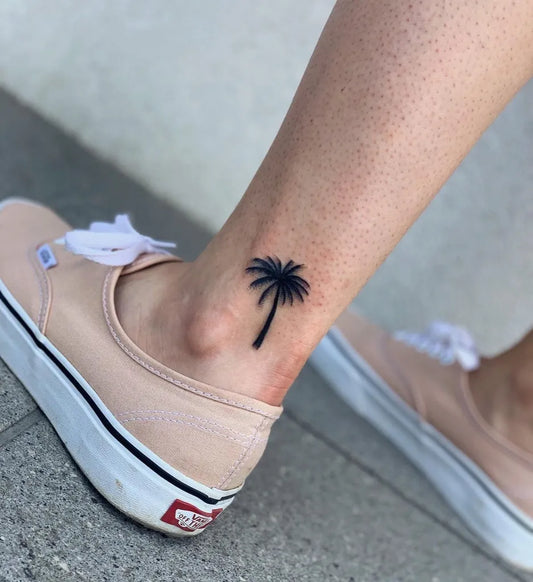 Small Minimalist Palm Tree Tattoo on Women Ankle by @szymon_radzik