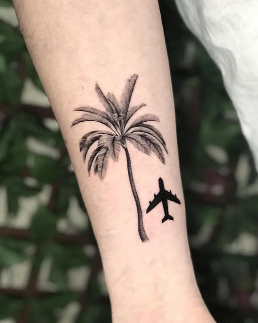 Small Minimalist Palm Tree and Airplane Tattoo on Women Arm by @yantinotattoo_ubud