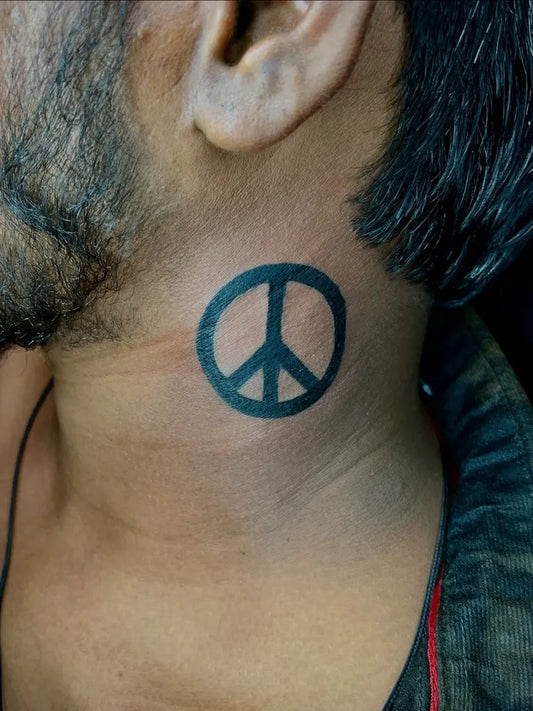 Small Minimalist Peace Symbol on Men Neck Tattoo by @nesh_tattoos