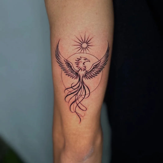 Small Minimalist Phoenix and Sun on Women Arm Tattoo by @riseinktattoo_and_nailart