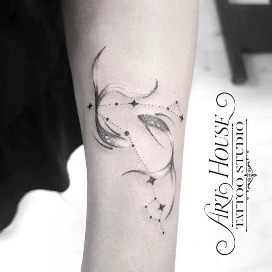 Small Minimalist Pisces Constellation Tattoo on Women Arm by @arthouse_tattoo_studio