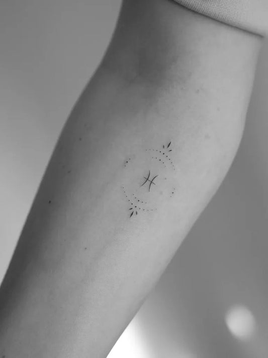 Small Minimalist Pisces Symbol Tattoo on Women Arm by @mrs.tattoo_