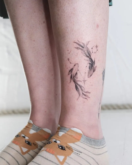 Small Minimalist Pisces Tattoo on Women Leg by @jimmygalan