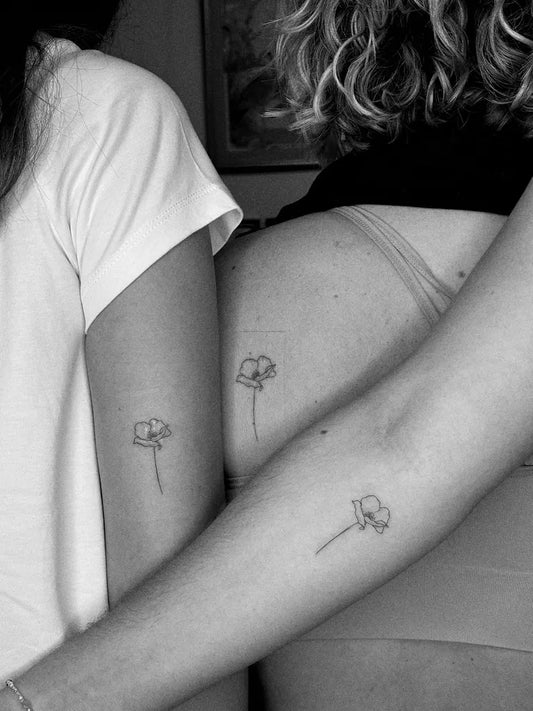 Small Minimalist Poppies on Friends Arms Matching Tattoo by @looezzink
