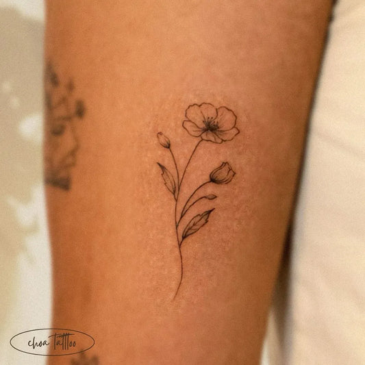 Small Minimalist Poppy Flower Stem with Buds on Women Thigh Tattoo by @choa._.tattoo
