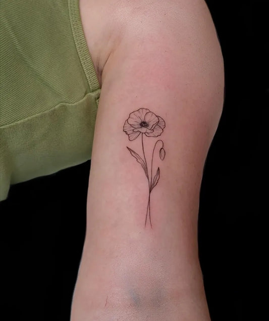 Small Minimalist Poppy Flower with Stem on Women Arm Tattoo by @tatt2taylor