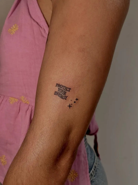 Small Minimalist Protect Your Energy Text on Women Arm Tattoo by @flipflop.tattss