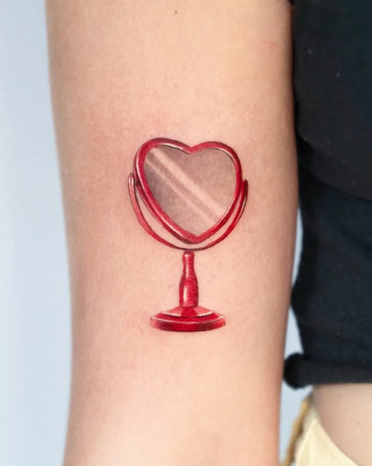 Small Minimalist Red Mirror Heart on Women Arm Tattoo by @maya_gat