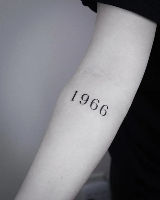 Small Minimalist Roman Numeral Number Tattoo on Women Arm by @jiyoo_tattoo