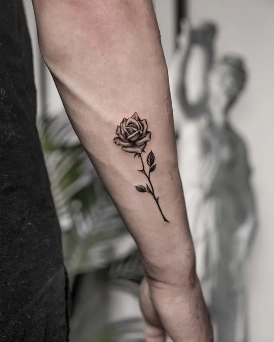 Small Minimalist Rose Stem on Men Arm Tattoo by @danielsilva