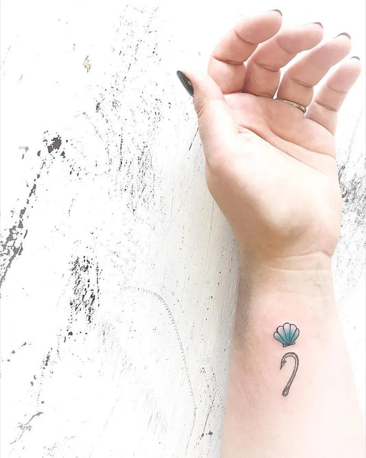Small Minimalist Seashell Semicolon on Women Wrist Tattoo by @destanielouise_tattoo
