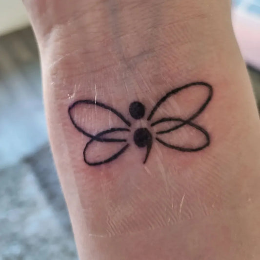 Small Minimalist Semicolon Dragonfly on Women Wrist Tattoo by @vegetarian_slimmer_in_progress