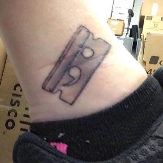 Small Minimalist Semicolon Razor Blade on Women Ankle Tattoo by @jessi_is_cooool