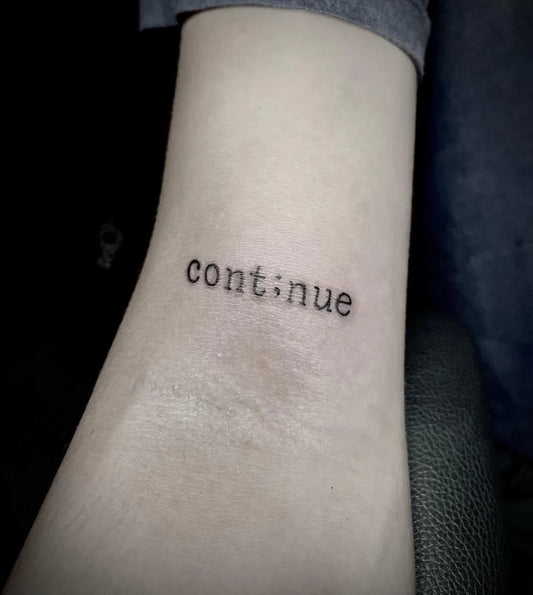 Small Minimalist Semicolon Text on Women Wrist Tattoo by @paeng.tinta