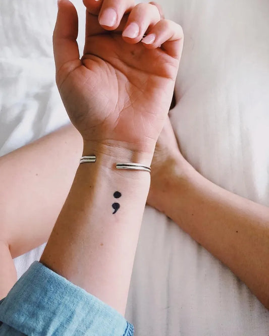 Small Minimalist SemicolonBracelets on Women Wrist Tattoo by @sophia_rabe