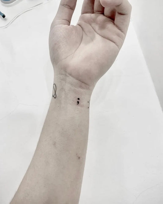 Small Minimalist SemicolonInfinity on Women Wrist Tattoo by @tirta_arutalatattoo