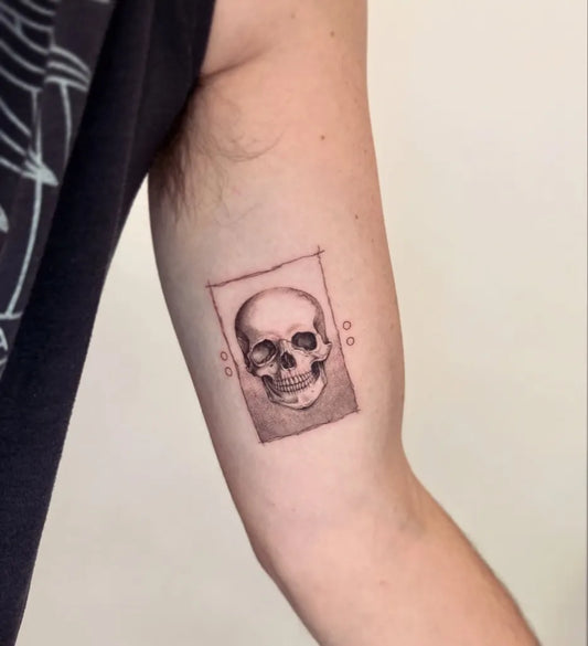 Small Minimalist Skull on Men Arm Tattoo by @circatattoo